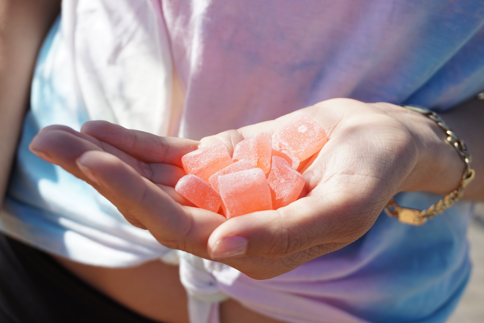 person holding orange cannabis edibles