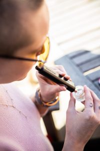 girl enjoying cannabis concentrate